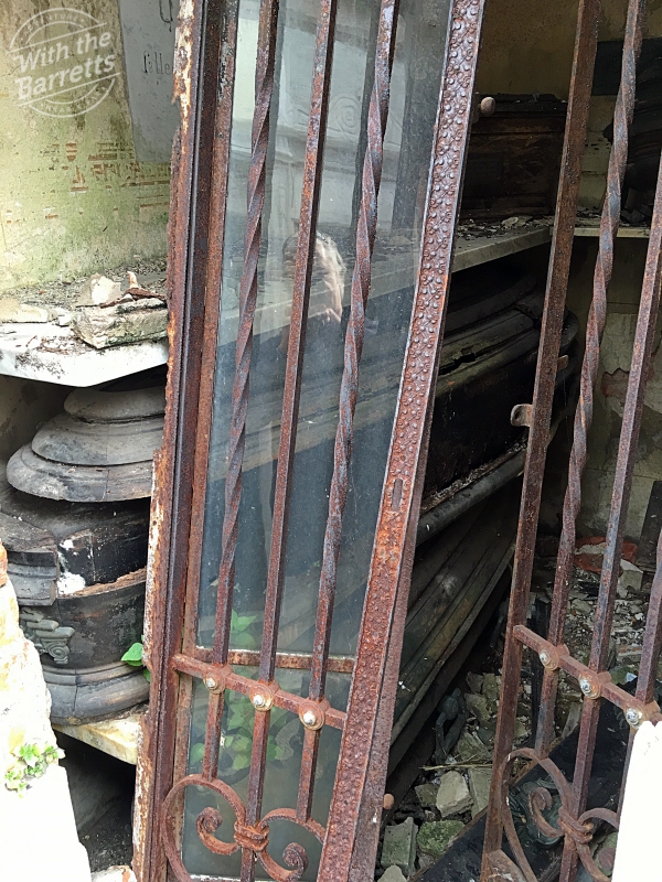 Disintegrating coffin - rusted gate