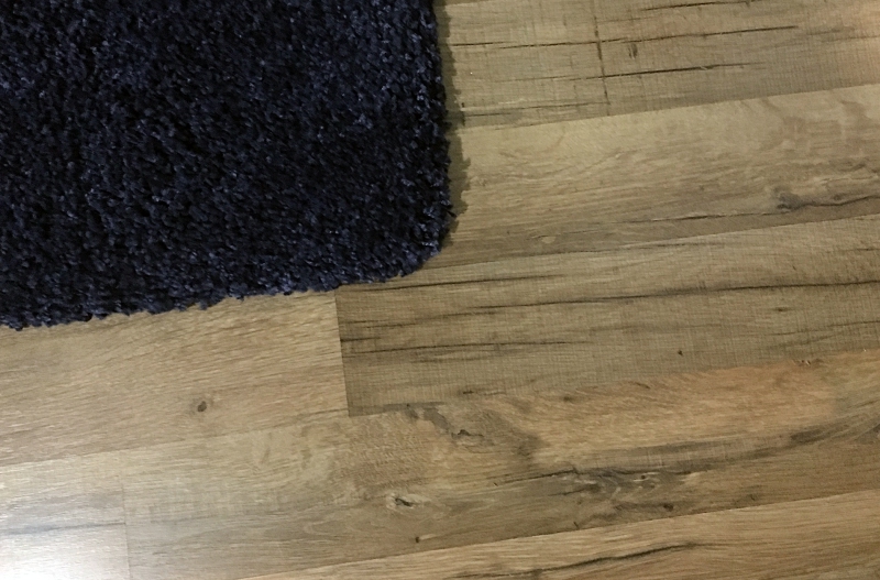 Laminate with navy rug in Boys' Room