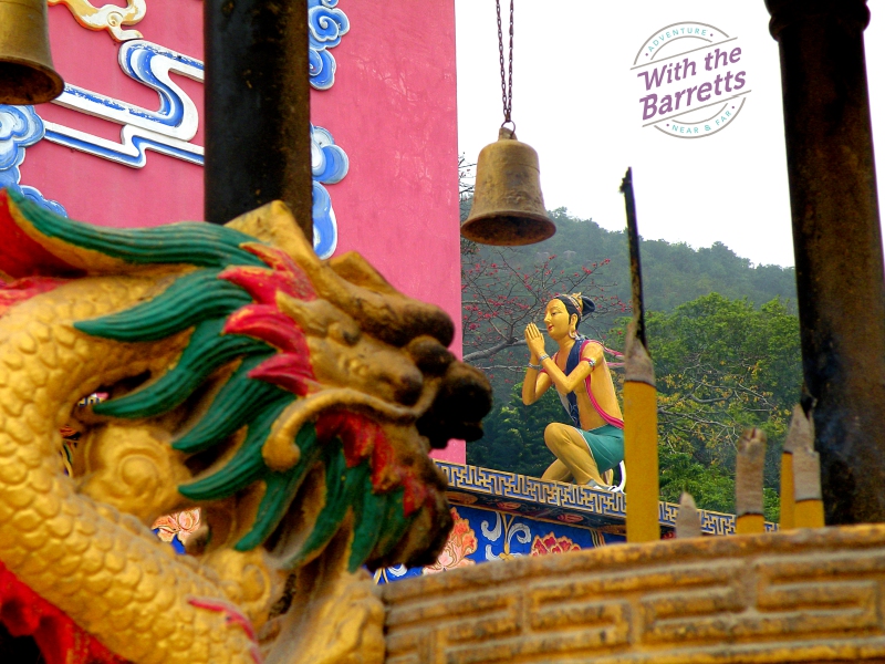 Layers of figures with mountain in the background