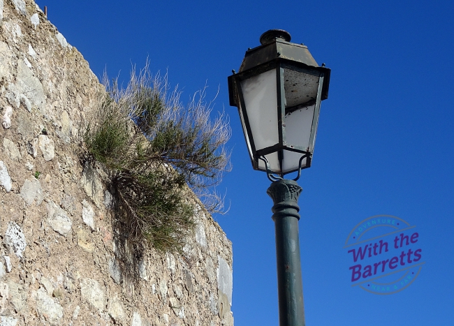 wall and light post with broken pane