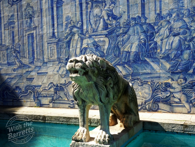 Lion sculpture with tile background